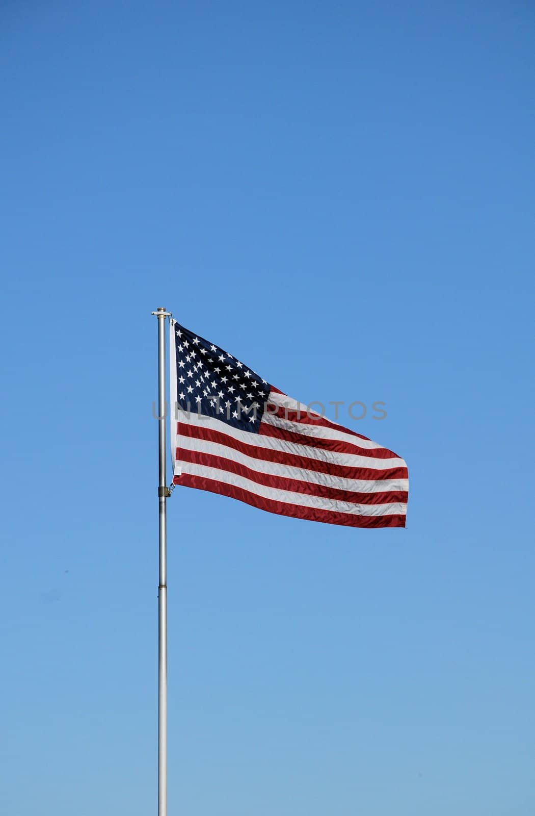 An American flag blowing in the wind