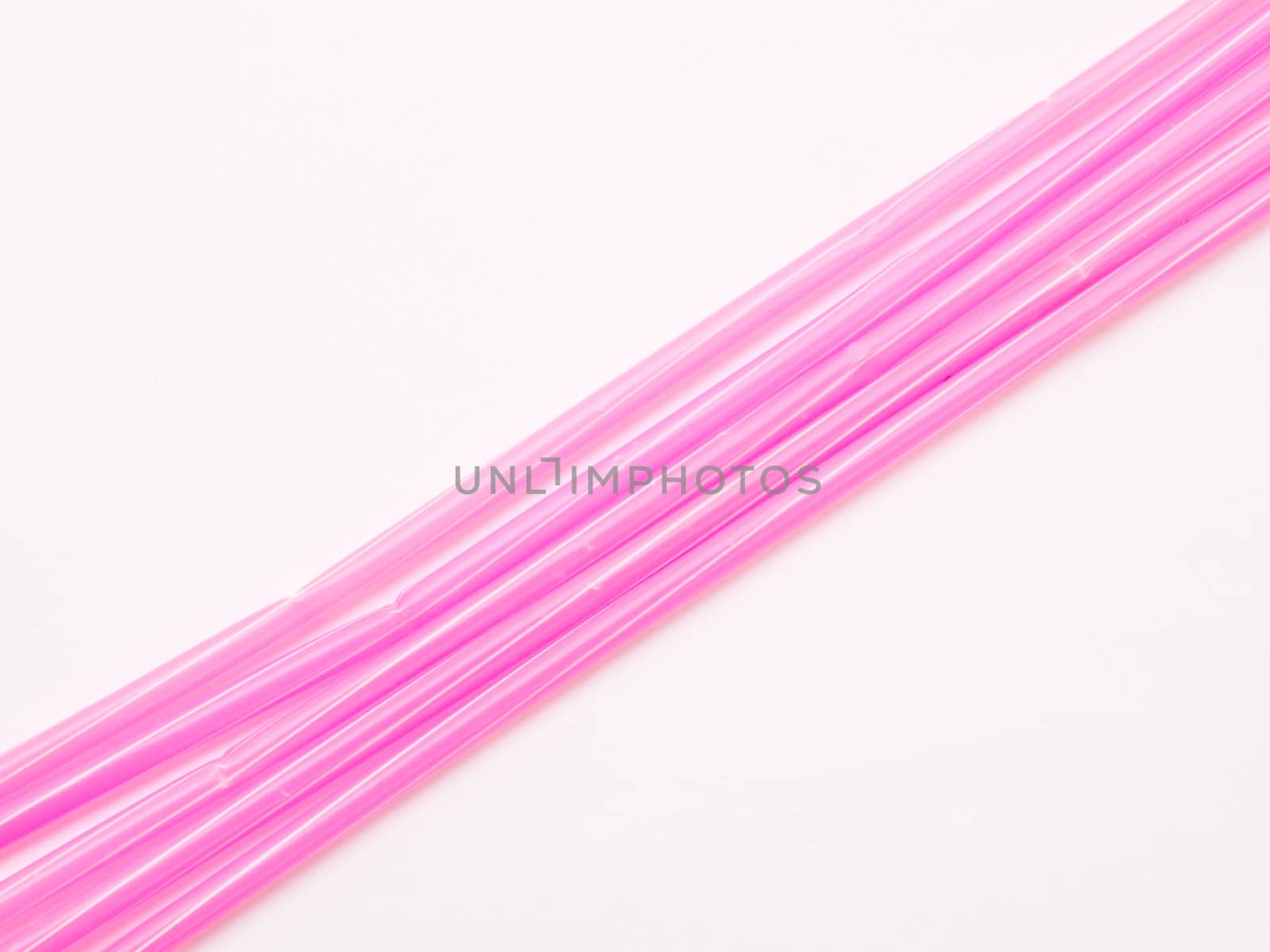 Pink straws isolated on white background