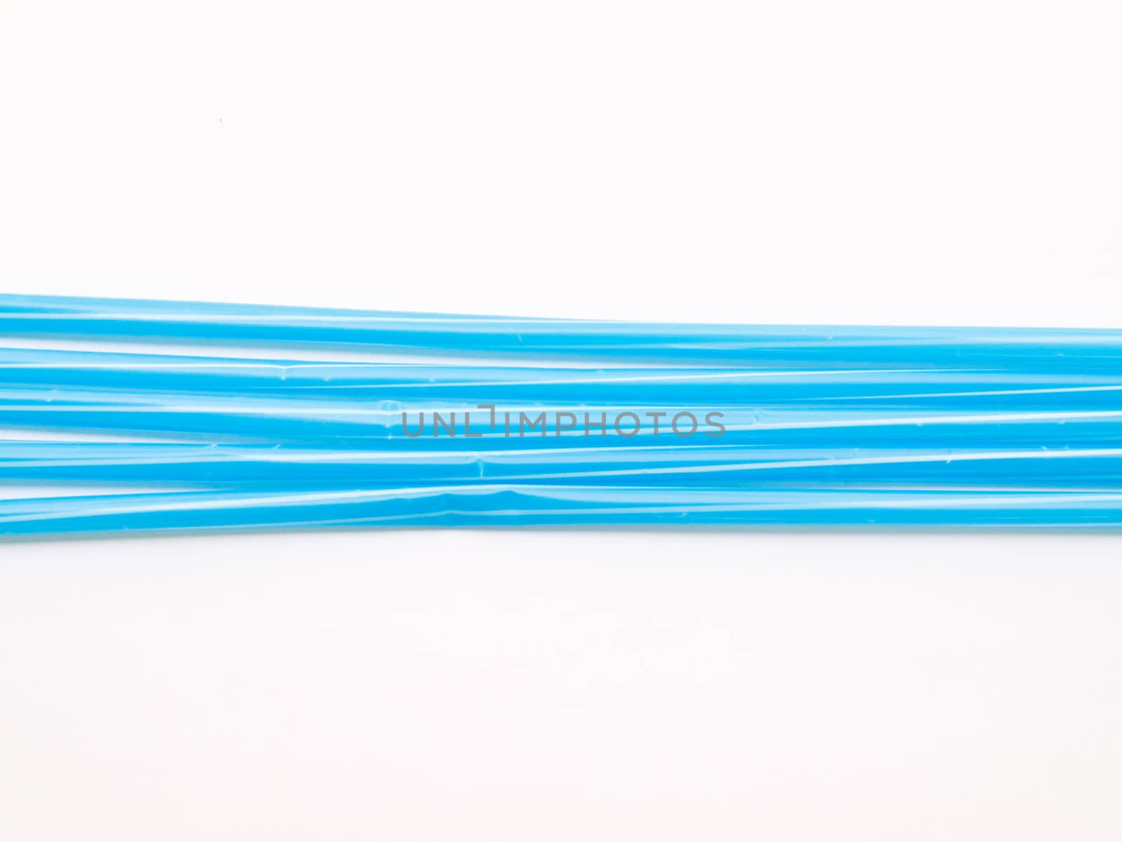 Light blue straws isolated on white back ground