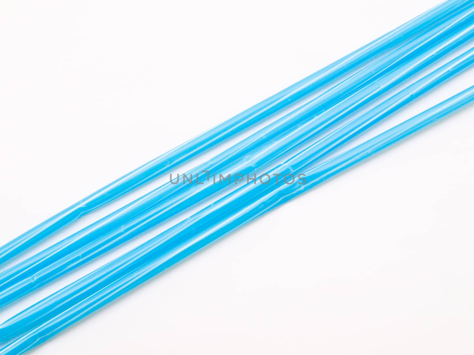 Light blue straws isolated on white back ground