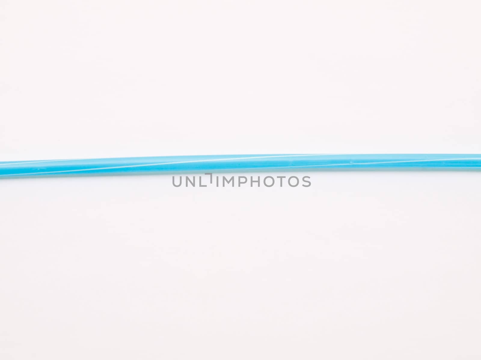 Light blue straw isolated on white back ground