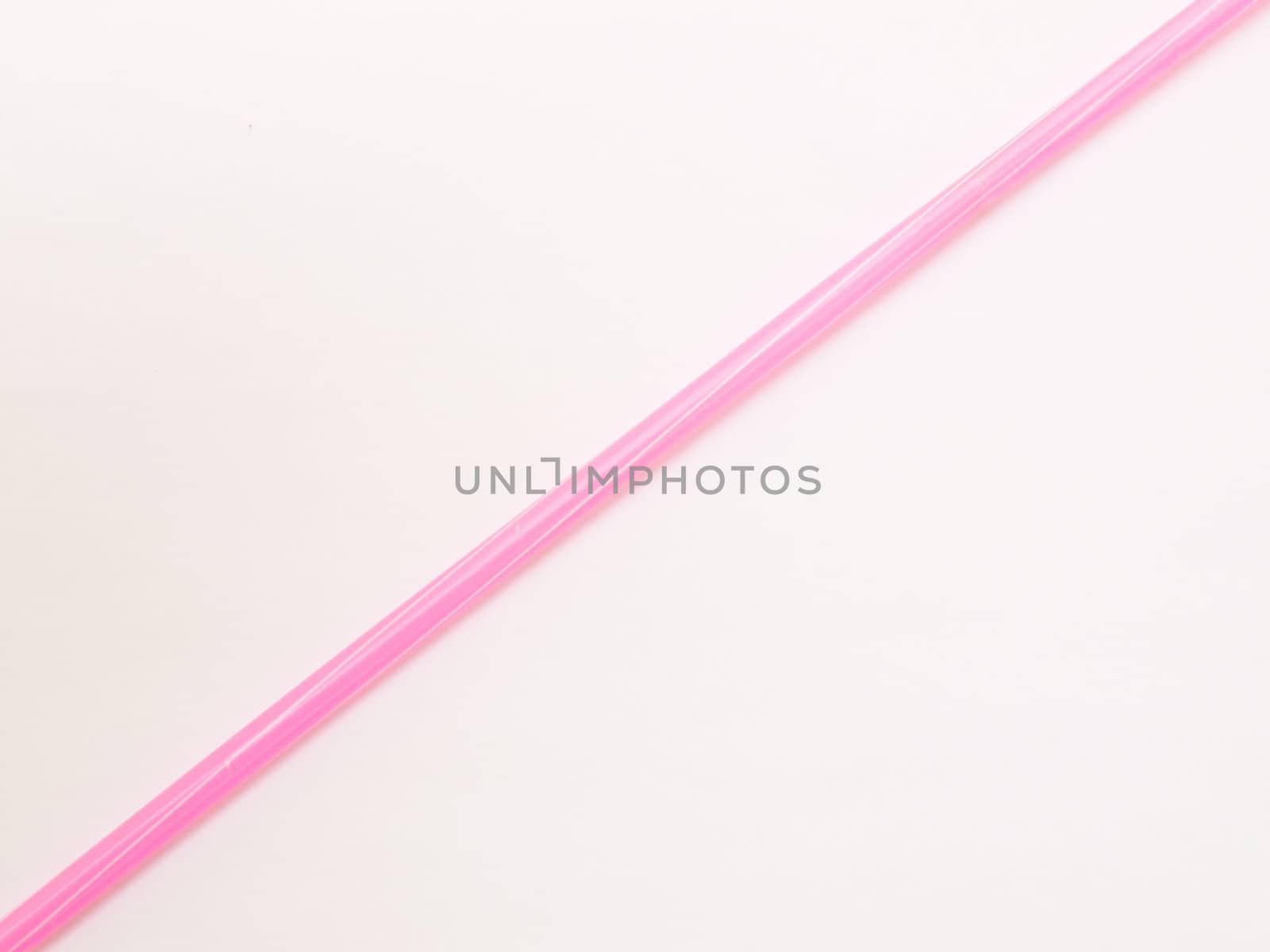 Pink straw isolated on white background