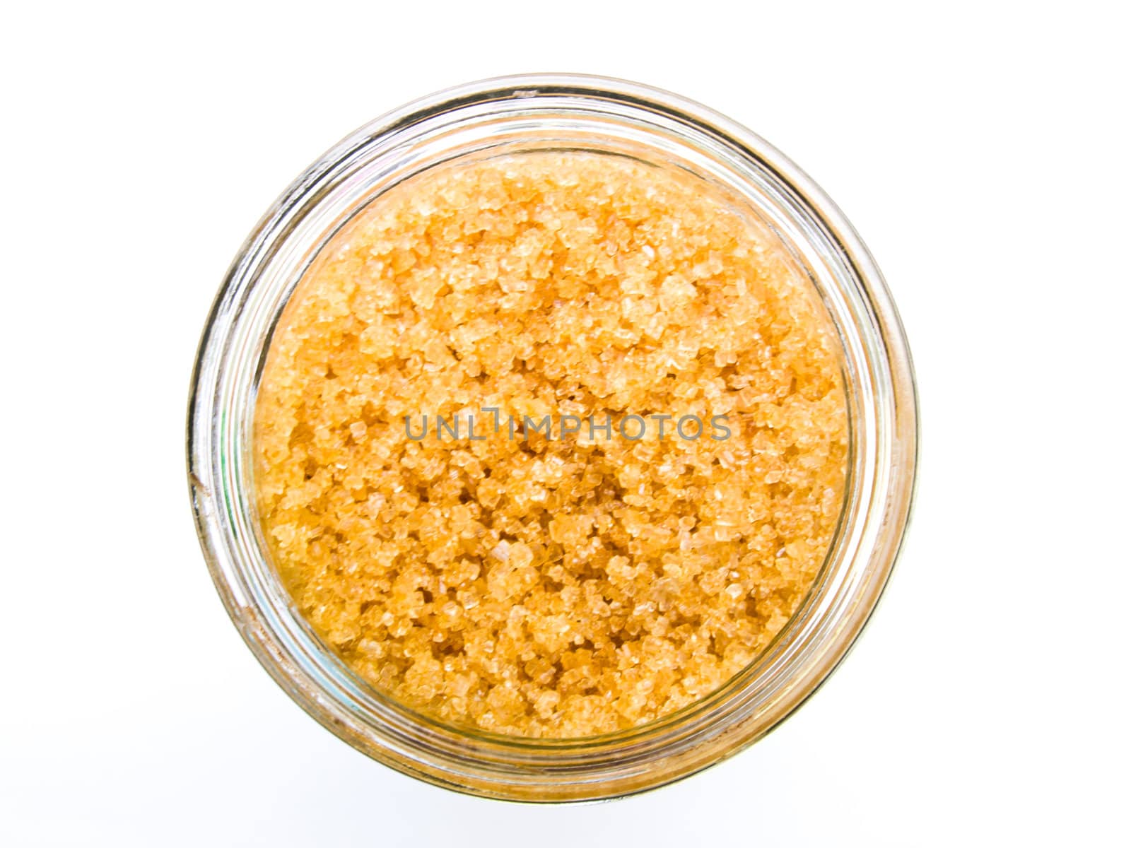 Brown sugarin a glass bottle from Top view isolated on white background