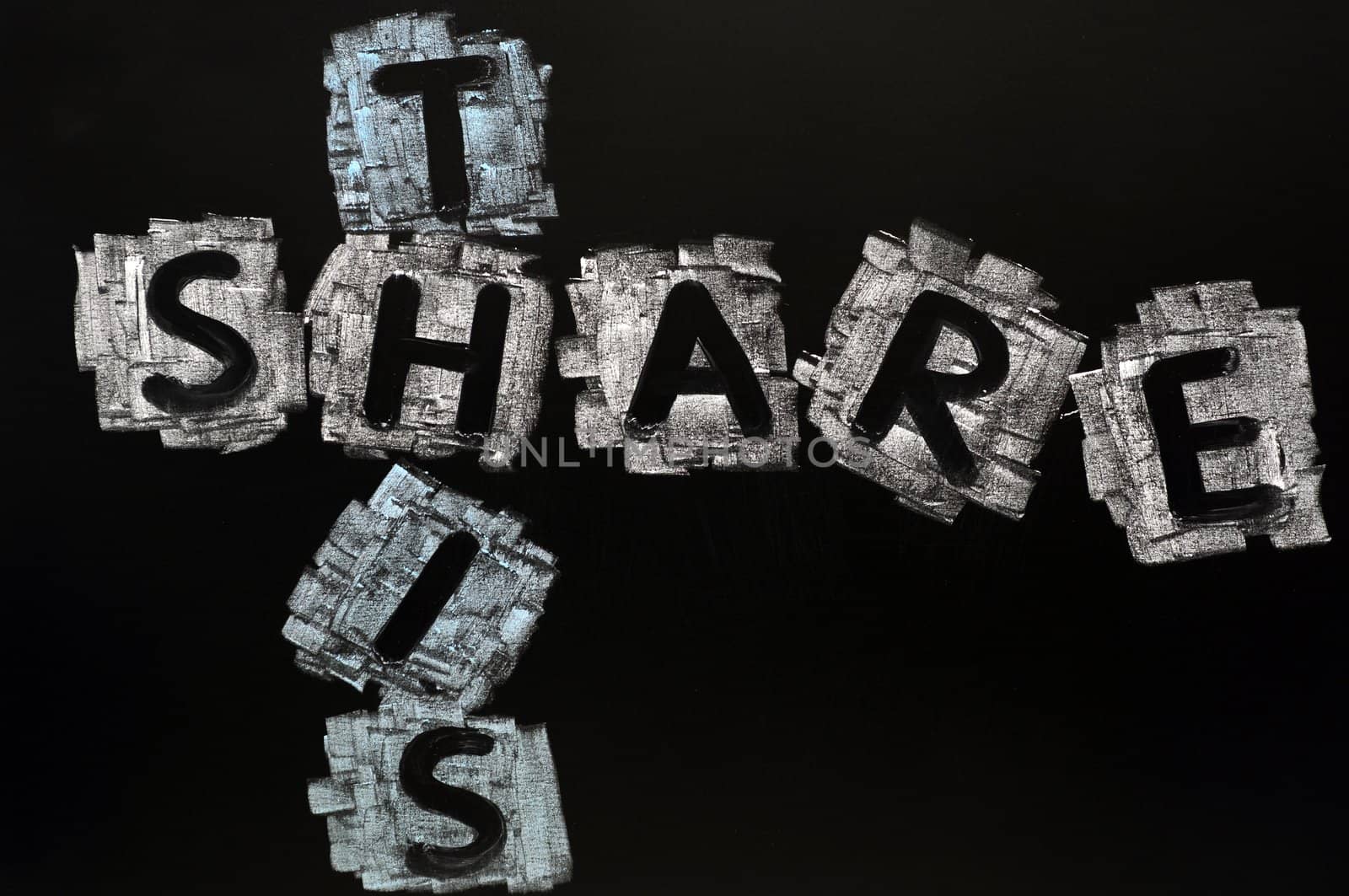 Crossword of Share Here written in chalk on a blackboard