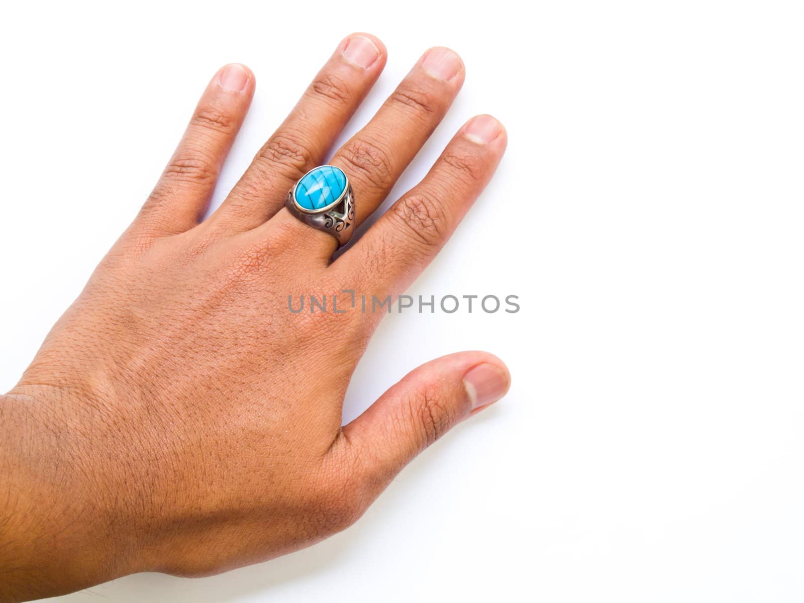 A guy hand with turquoise ring on his finger isolated on white background