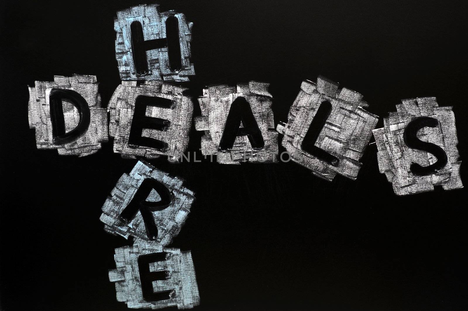 Crossword of Deals Here written in chalk on a blackboard