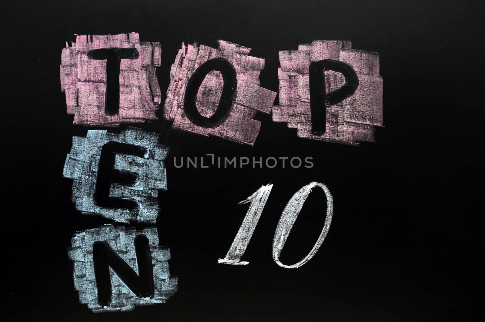 Crossword of Top Ten drawn in chalk on a blackboard