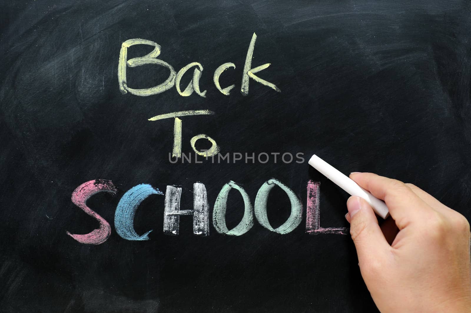 Chalkboard Background with a handwriting of "back to school"