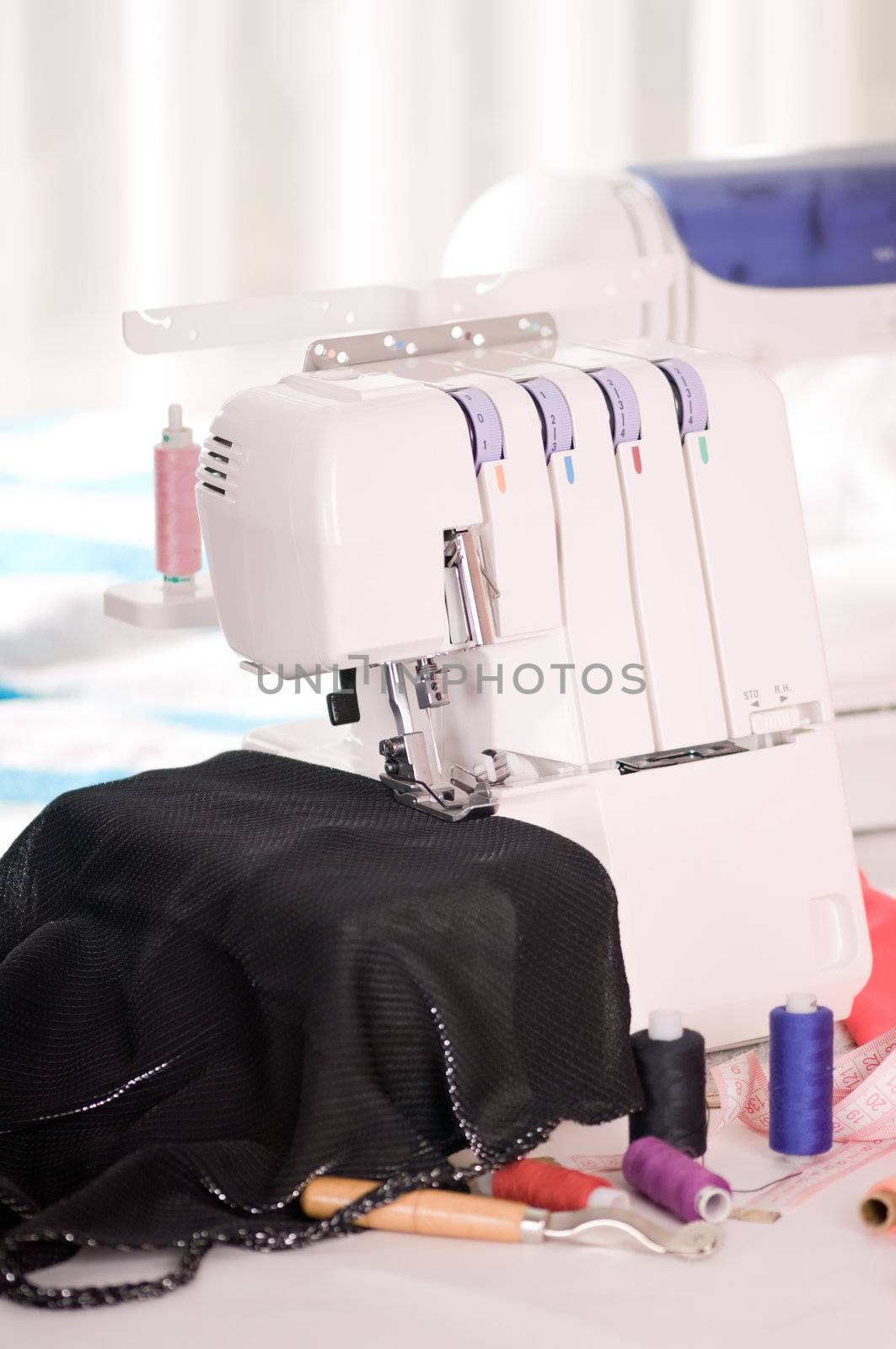 overlock and sewing machine is on the table