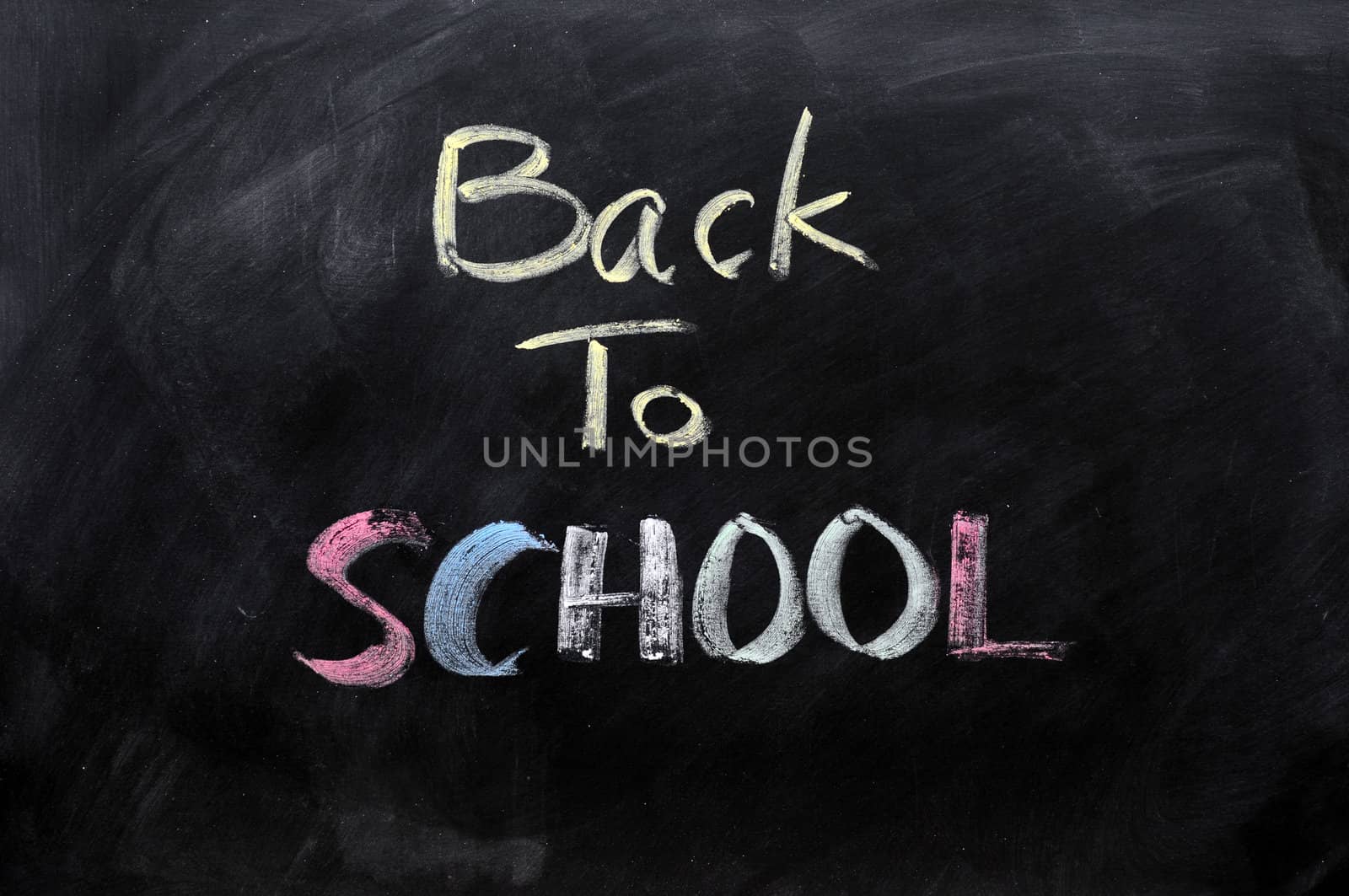 Chalkboard Background with a handwriting of "back to school"