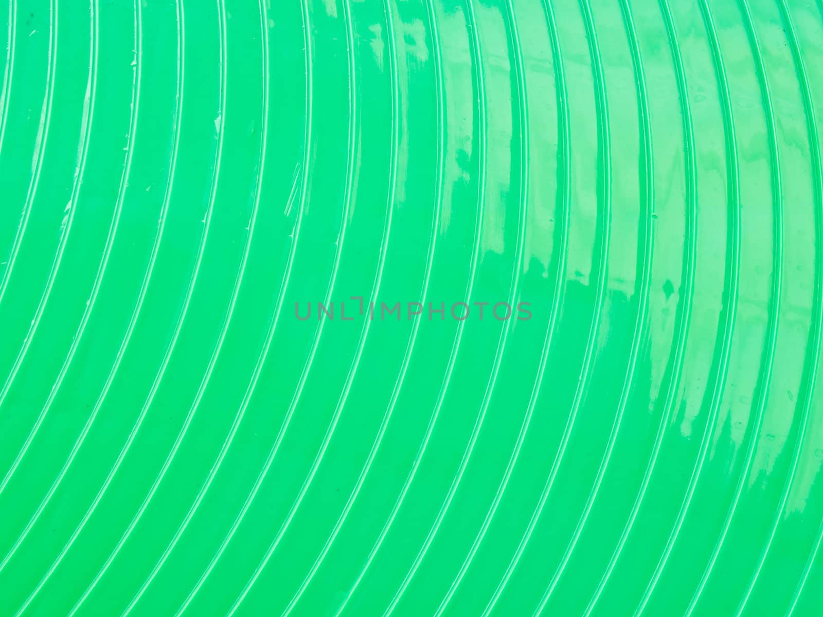 Curved green plasstic as background