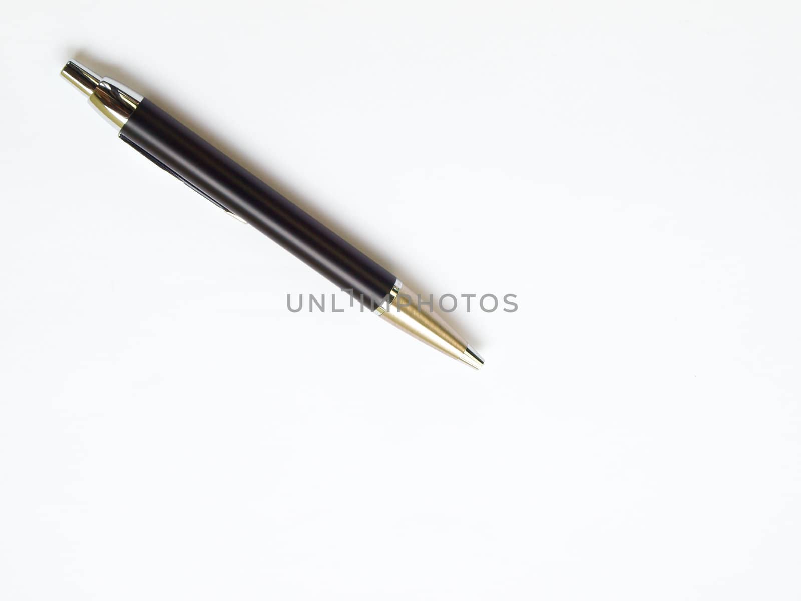 Black ball pen isolated on white background on top left