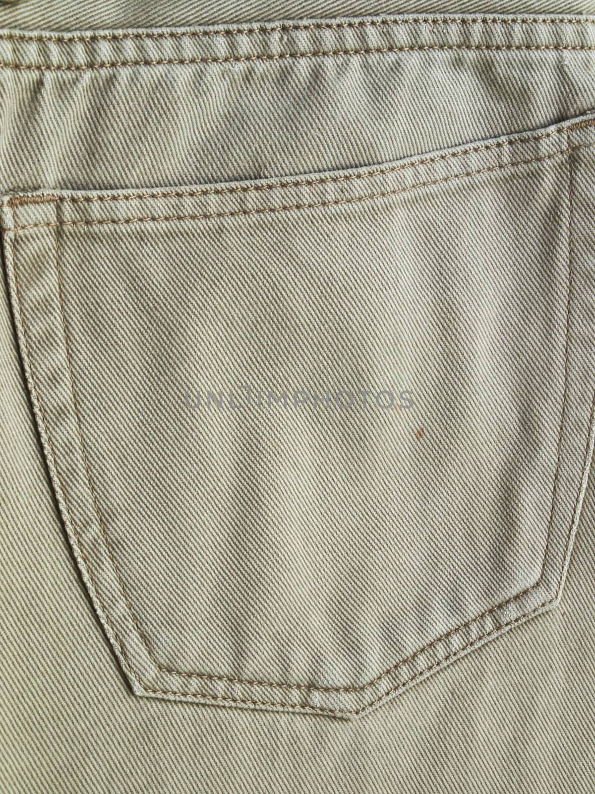 Close up back pocket on khaki jean pants by gururugu