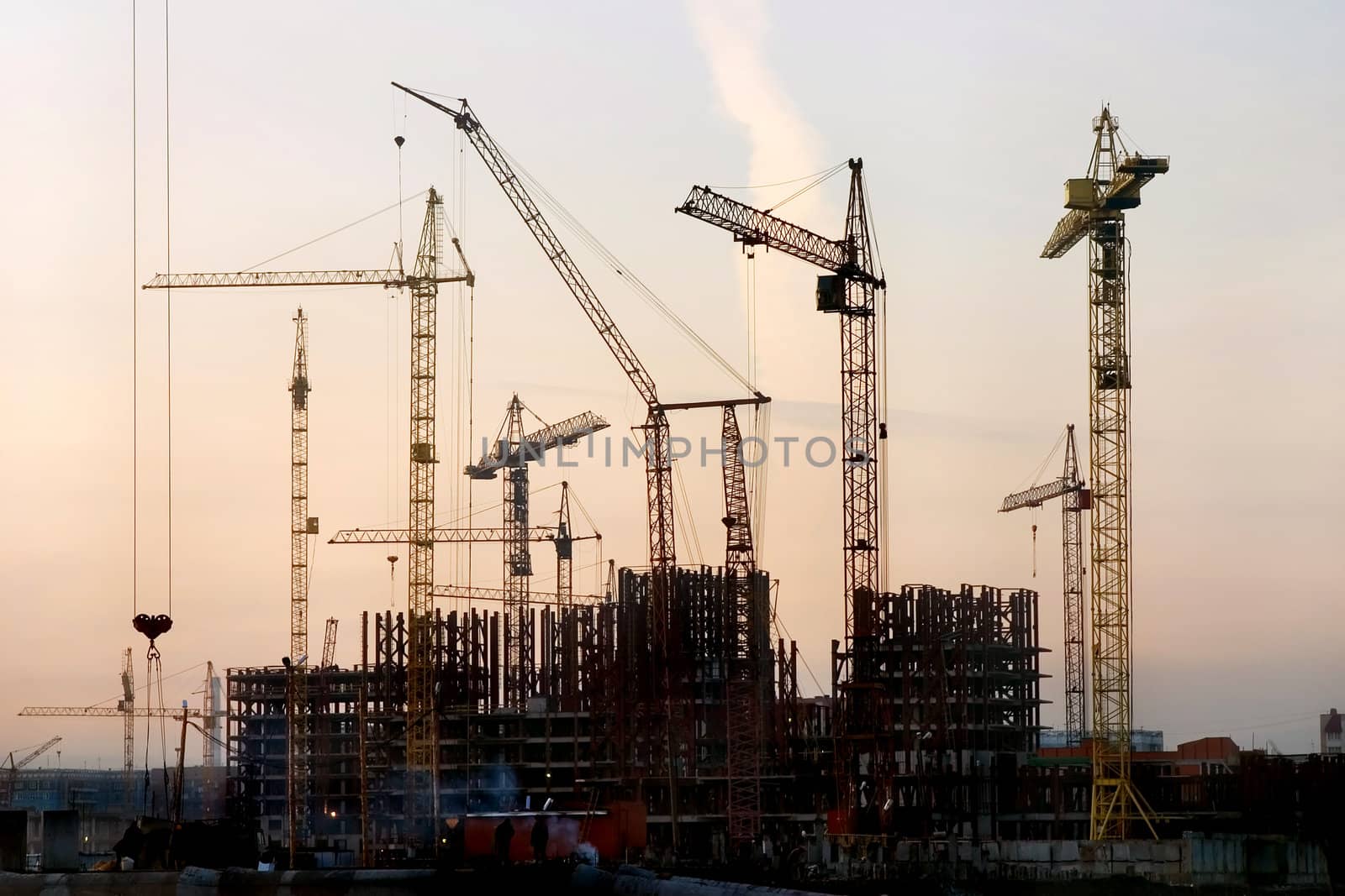 Kind on construction in the evening on a background of the sky