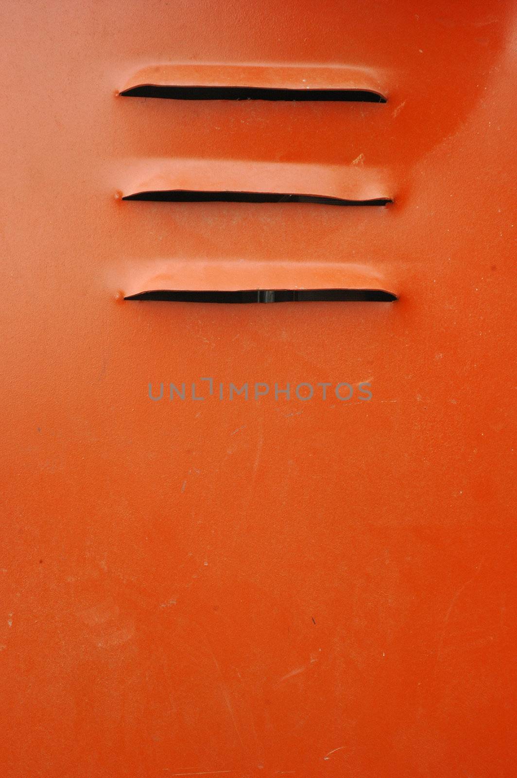 air holes in the orange iron wall