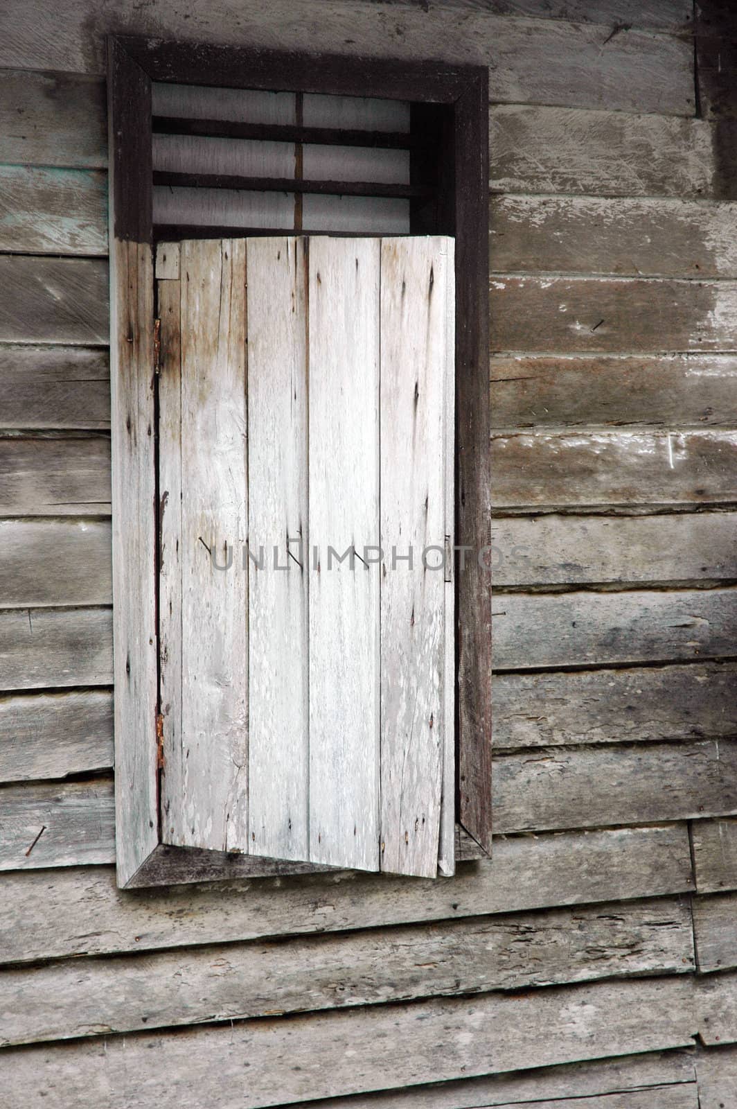 old wooden windows in the house of the periphery