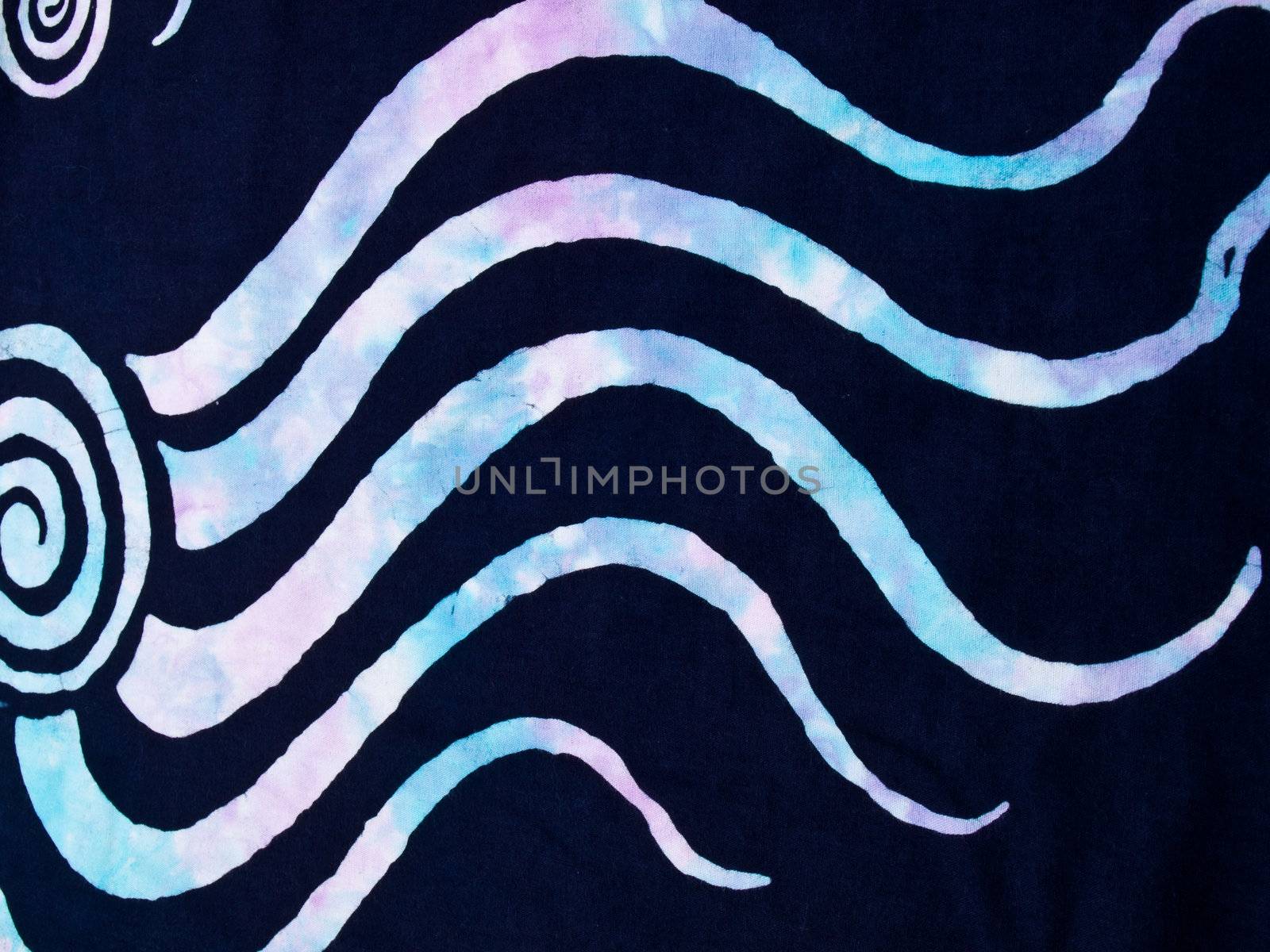 Colorful pattern on black fabric batik as background