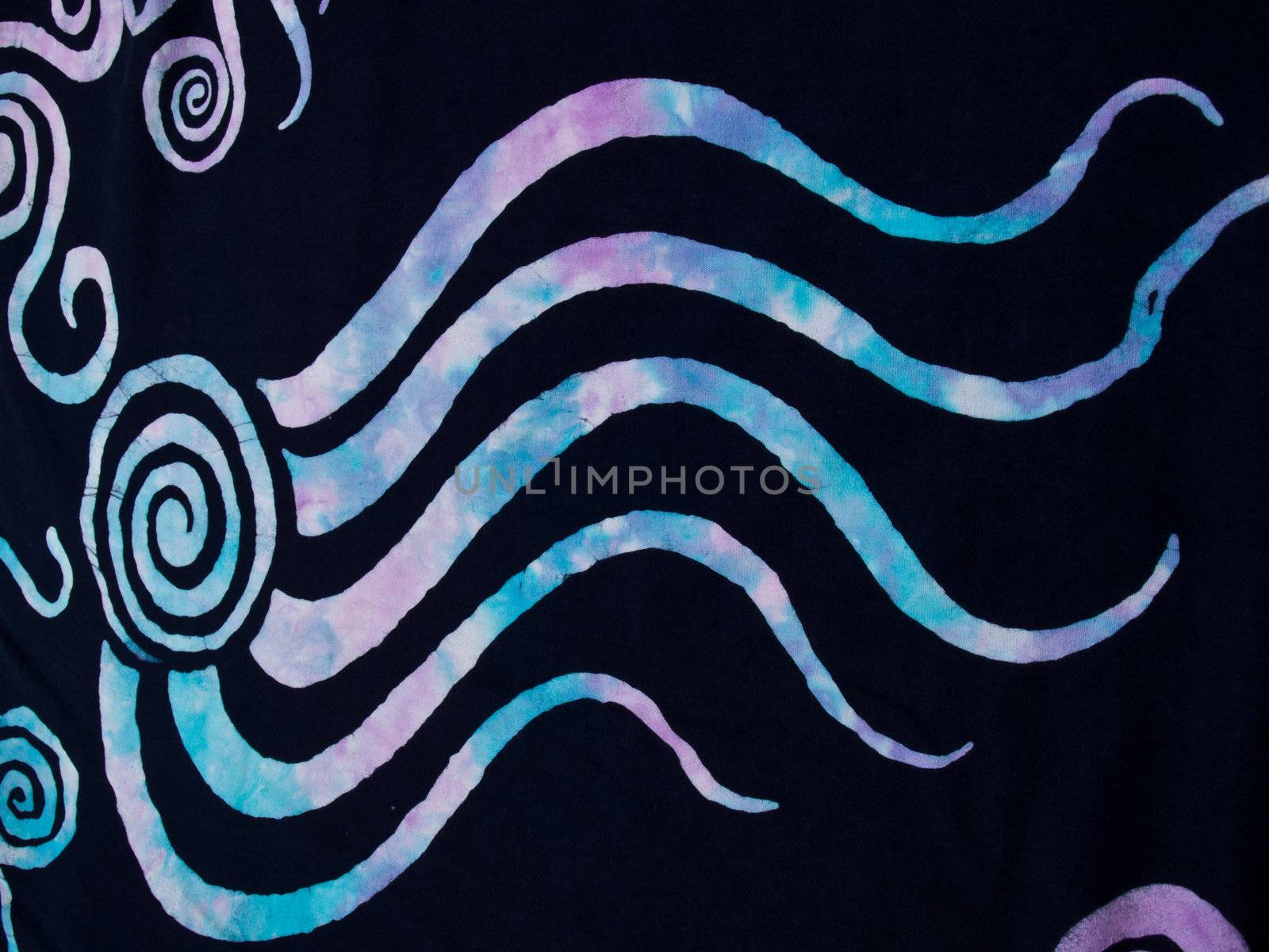 Colorful pattern on black fabric batik as background by gururugu