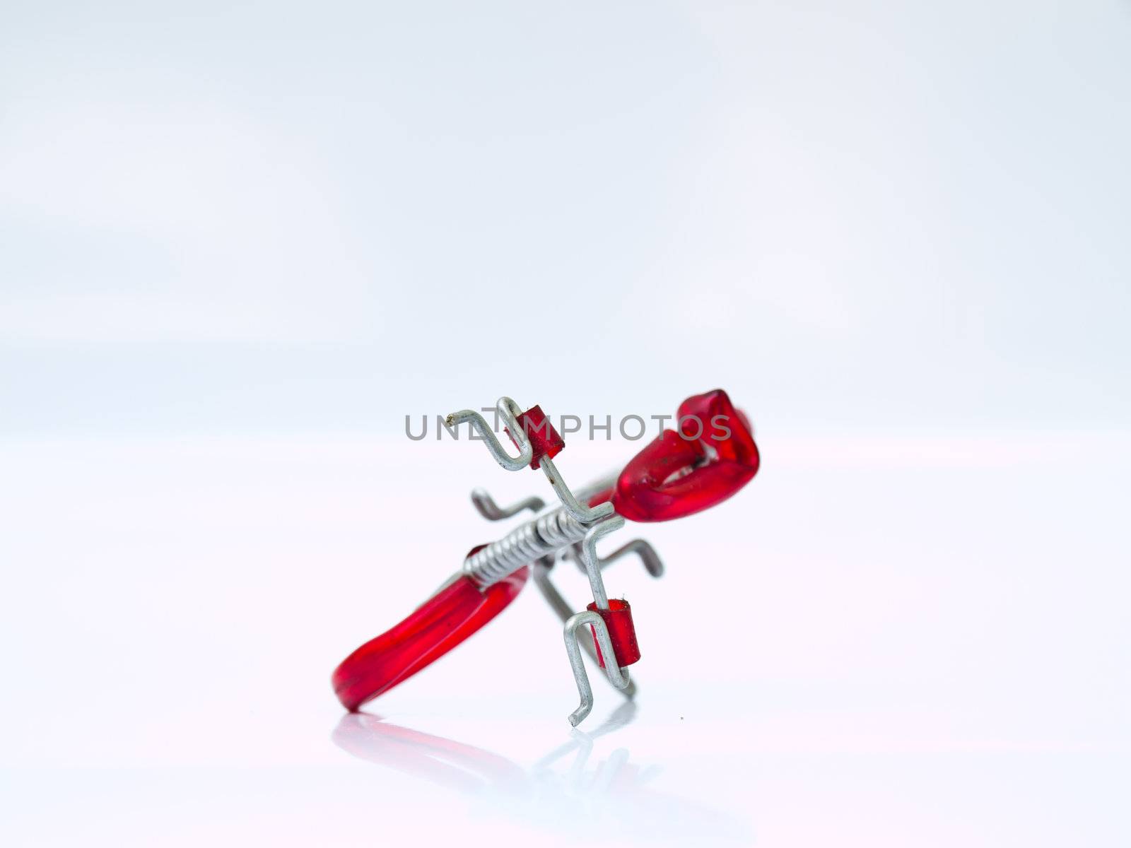 A miniature red bicycle isolated on white background by gururugu