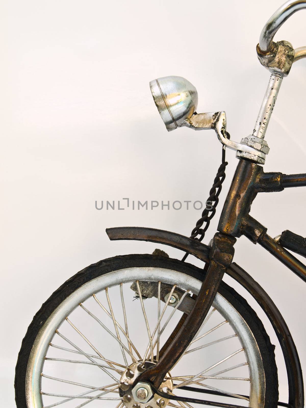 A front wheel of Iron bicycle model isolated on white background by gururugu