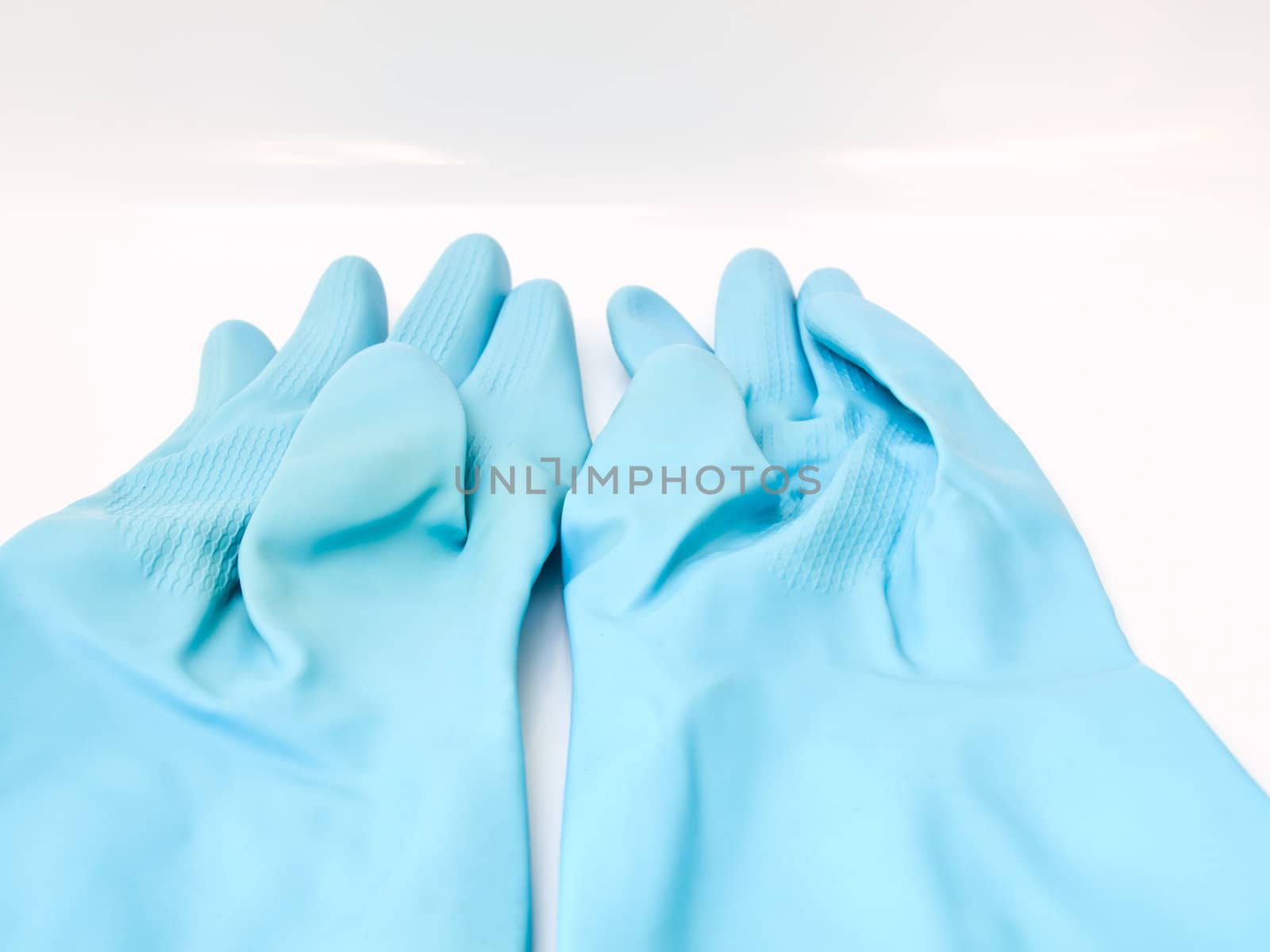 Two light blue rubber gloves