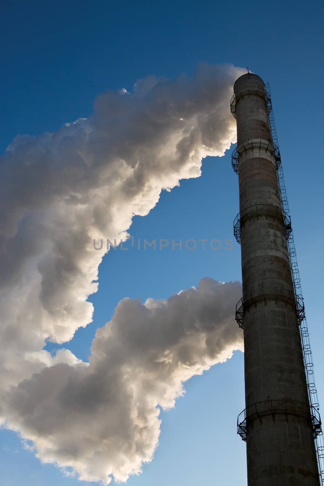 Smoke going from a factory pipe