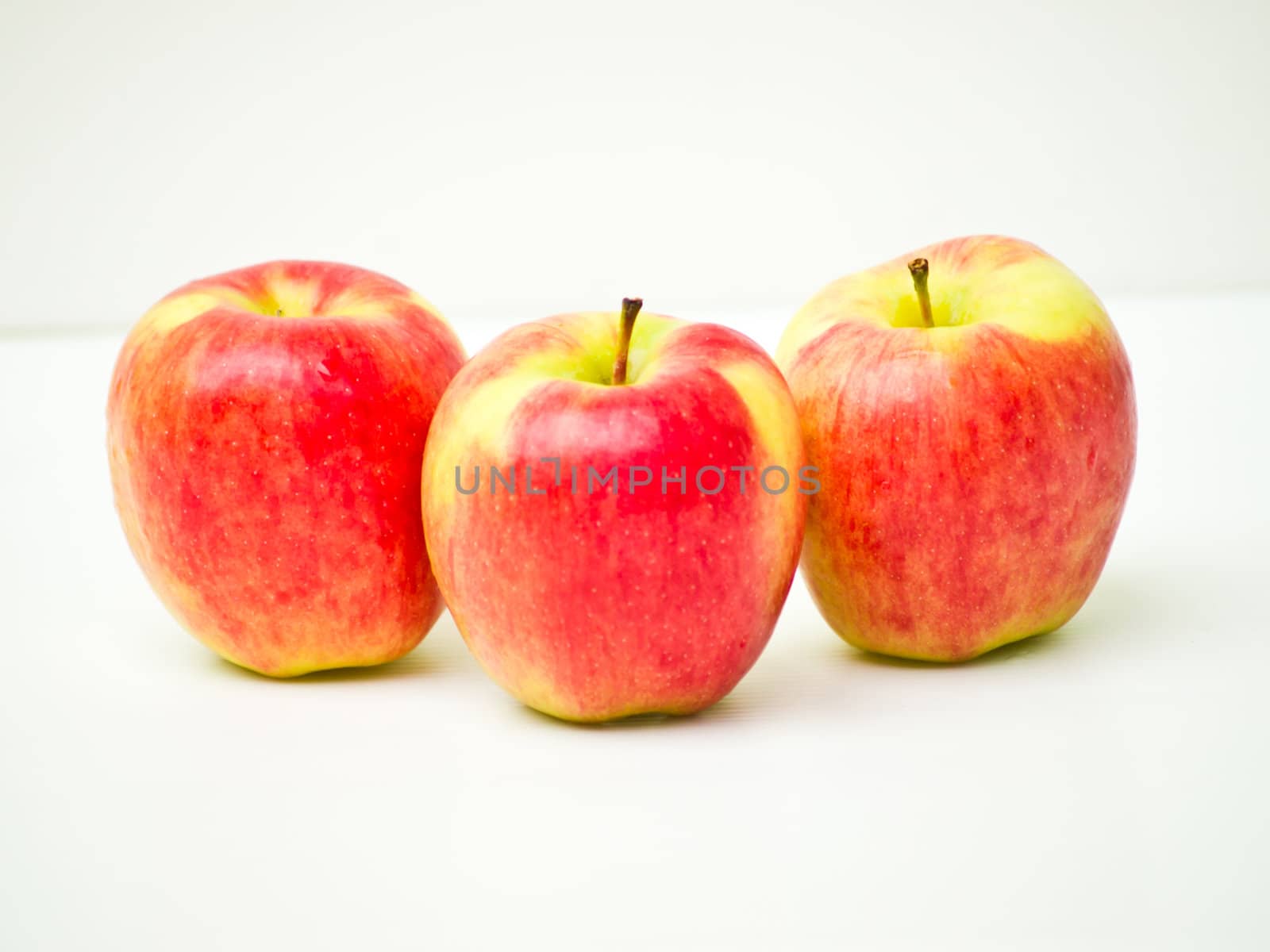 Red apples isolated on white background by gururugu