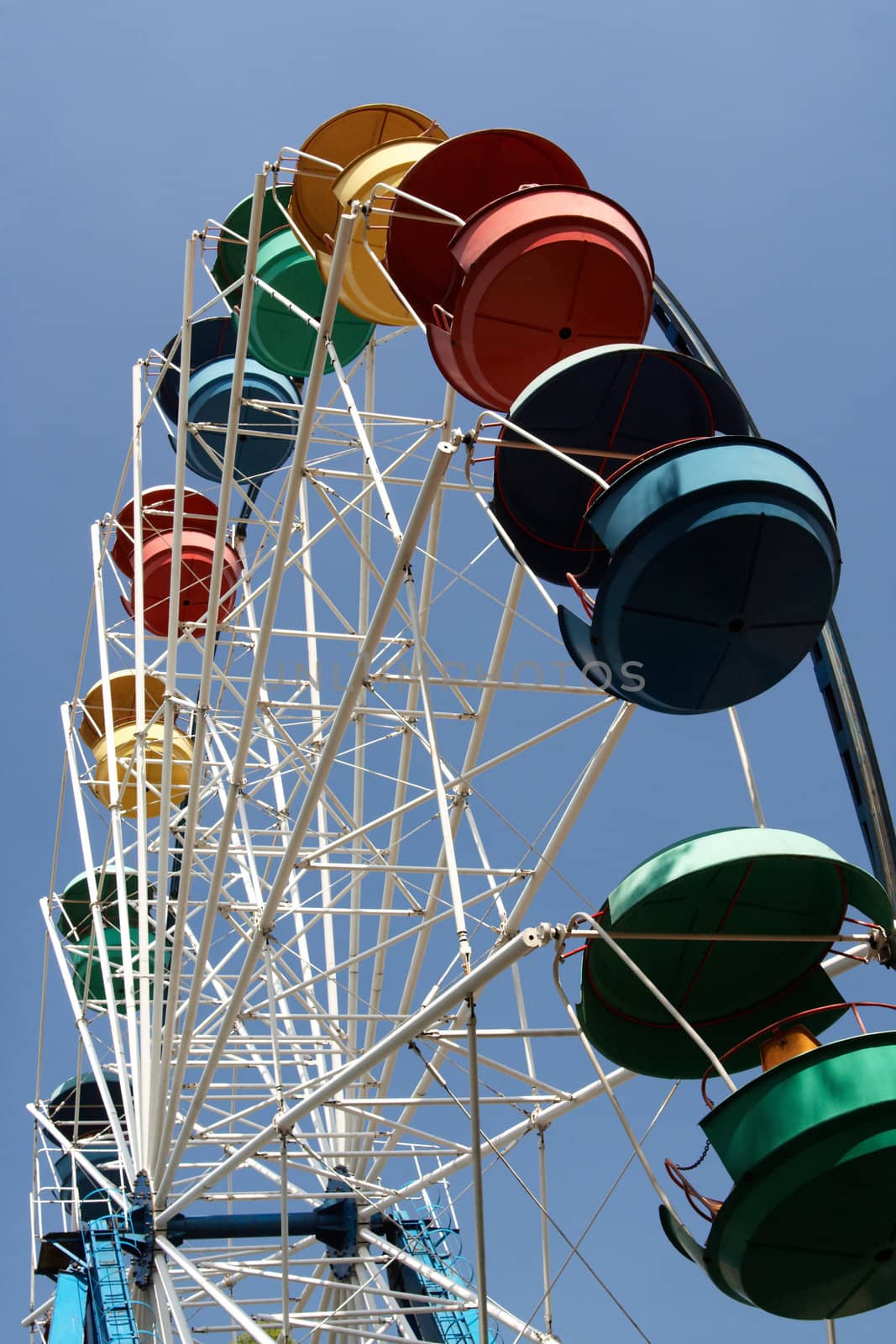 Ferris wheel on blue sky background