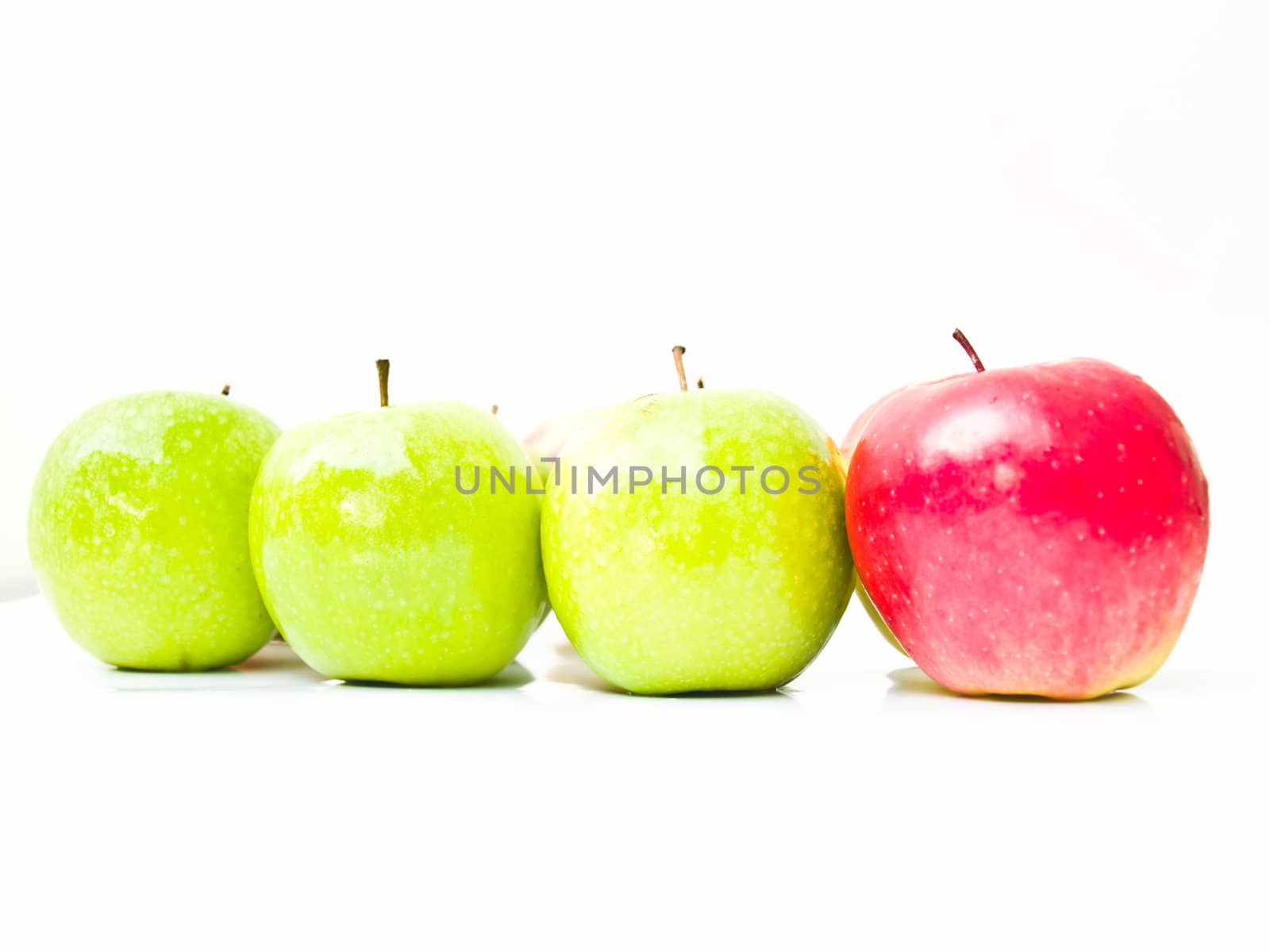 Green and red apples isolated on white background by gururugu