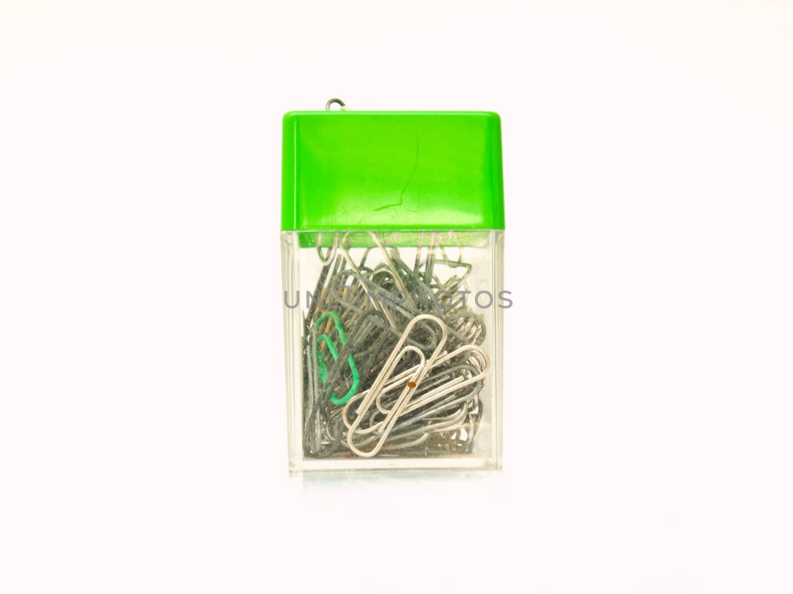 Used metal paper clips in used plastic container