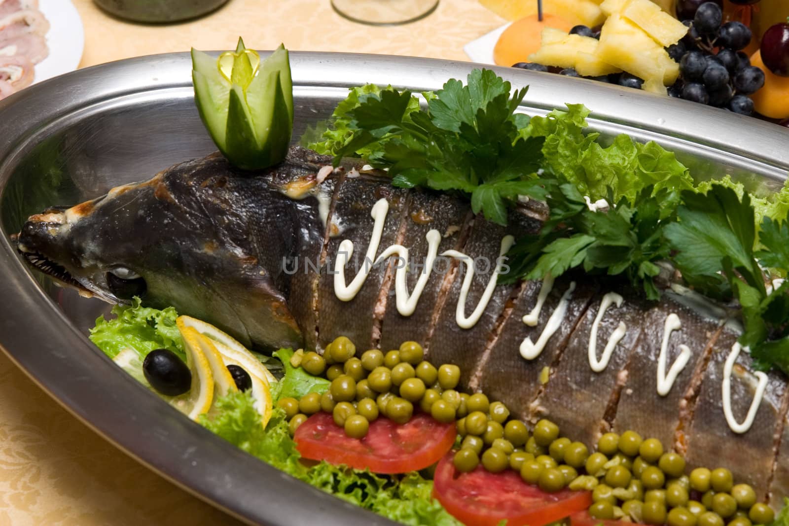 Fried fish on a dish with vegetables