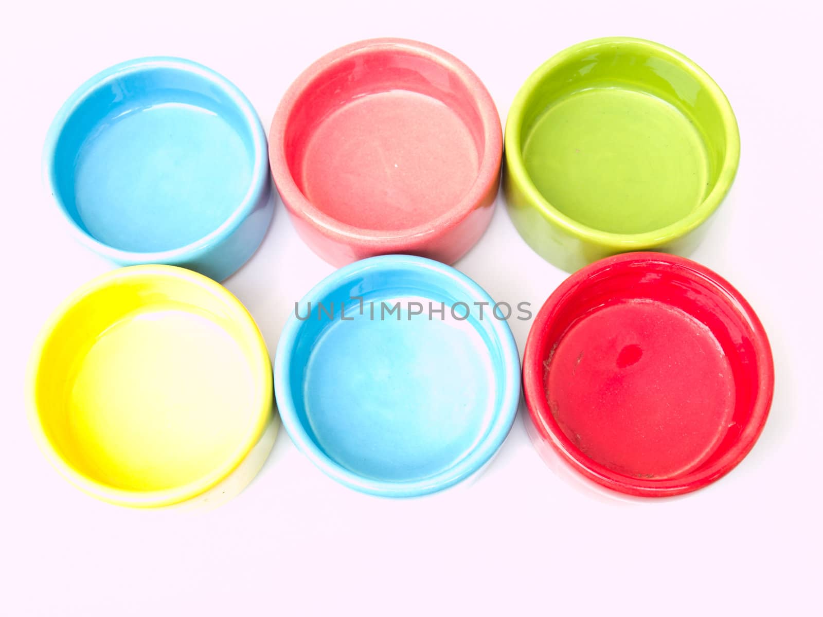 Colorful ceramic candle handles from topview isolated on white b by gururugu