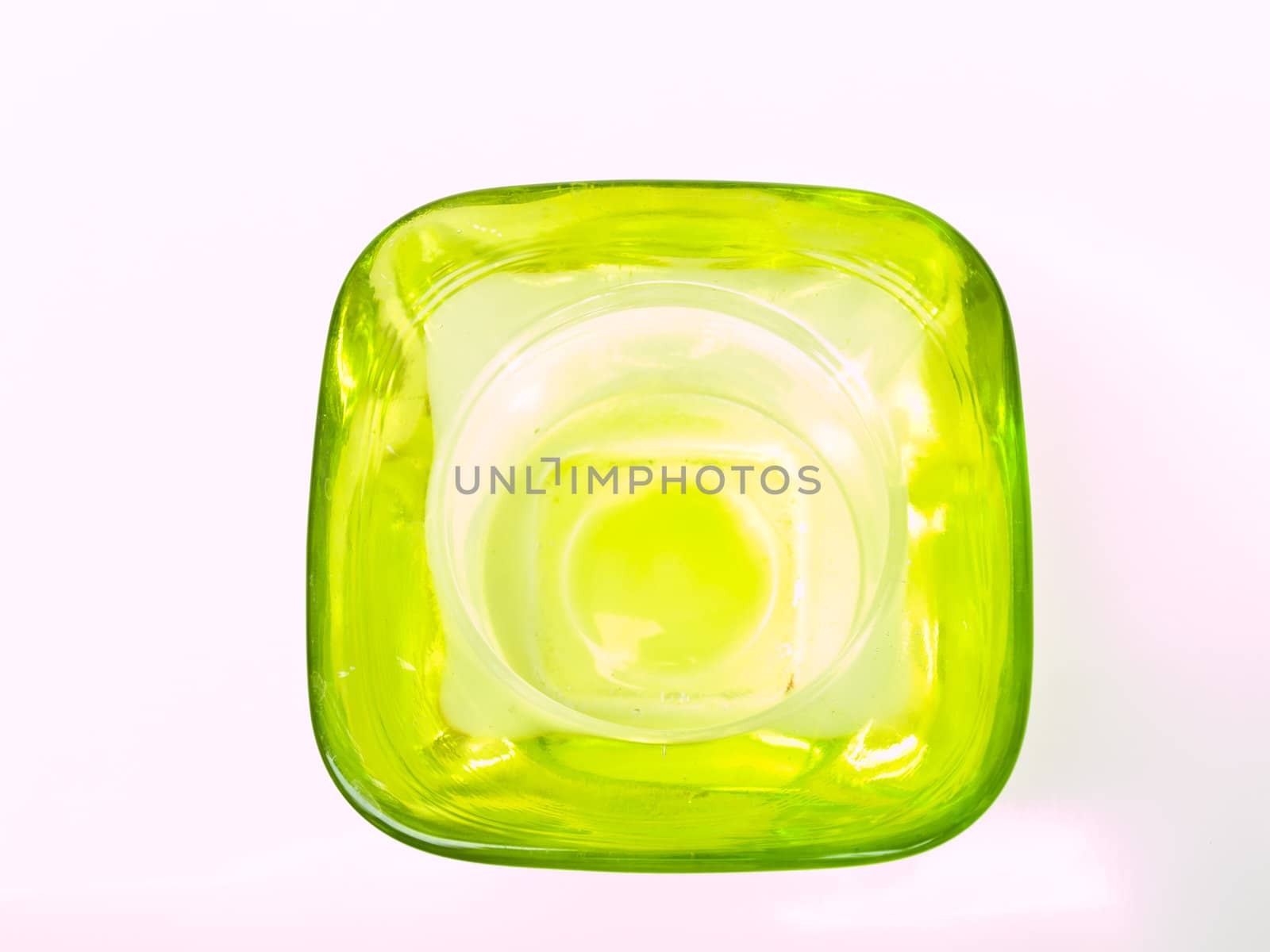 A green glass candle handle from topview isolated on white backg by gururugu