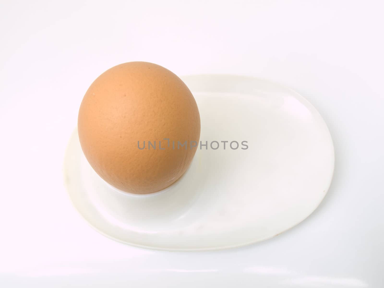 Soft boiled egg on a used plastic plate isolated on white backgr by gururugu