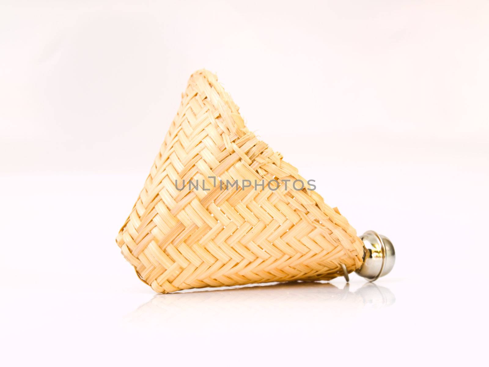 A Wicker basket key chain isolated on white background . by gururugu