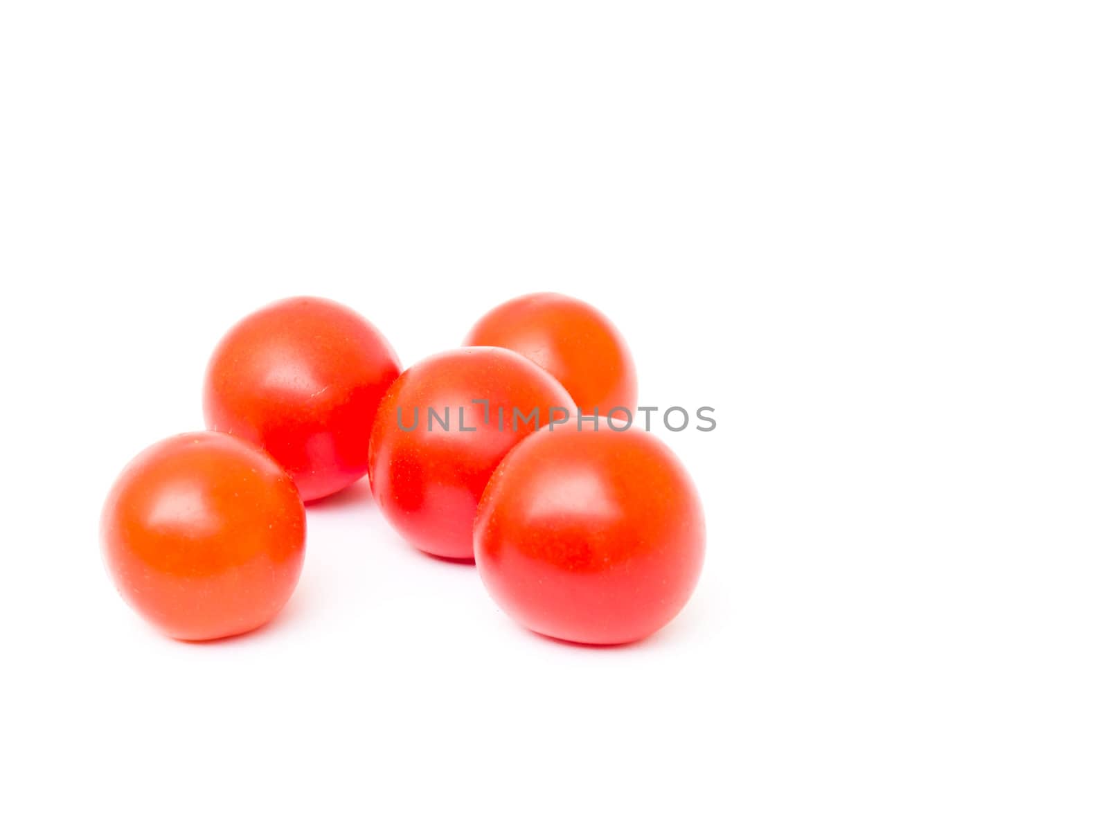 Cherry tomatoes isolated on white background by gururugu
