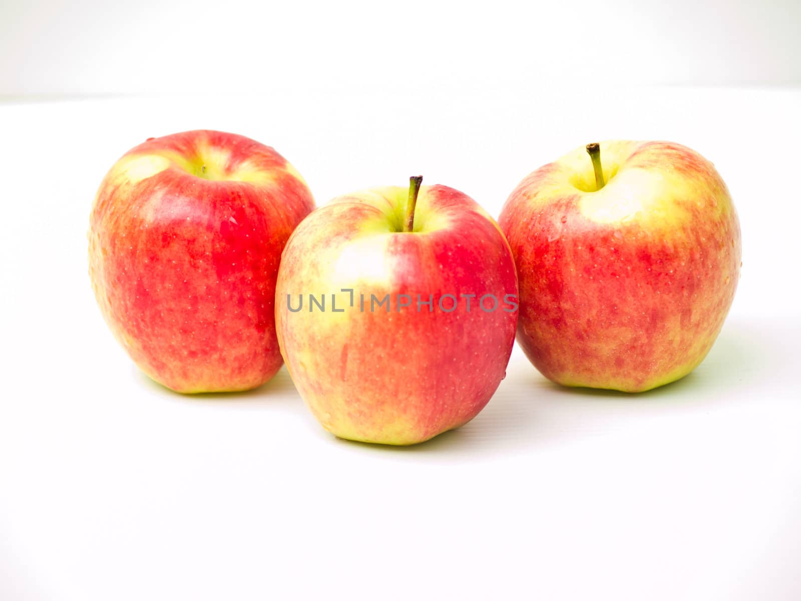 Red apples isolated on white background by gururugu