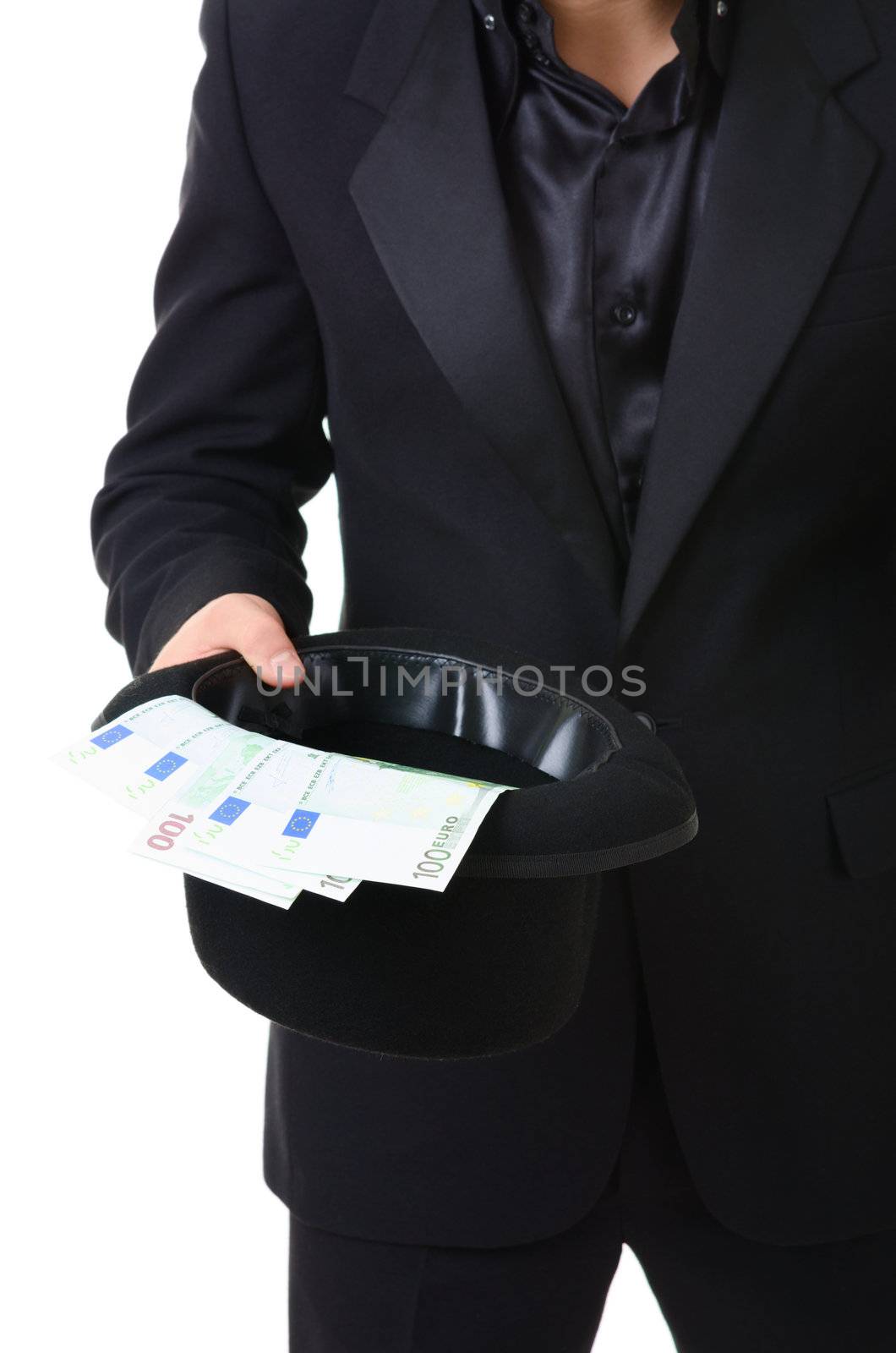 Euro paper money cash  in a hat holded by man in black suit