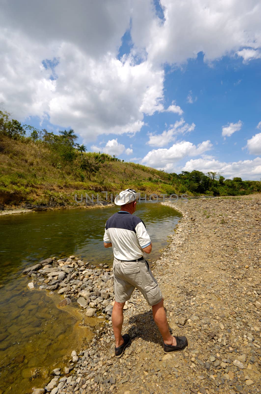 Man at river by cfoto