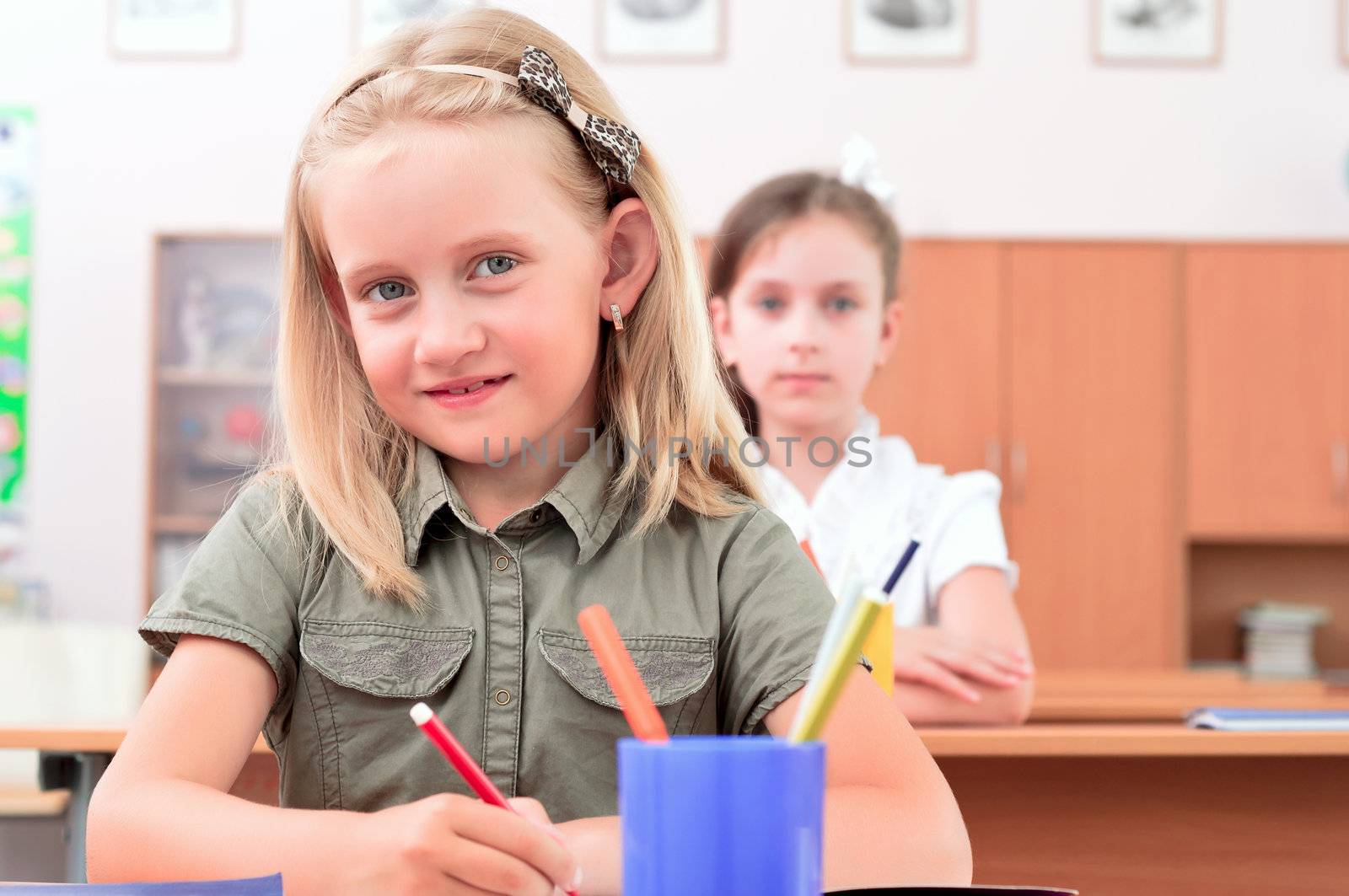 portrait of students in the classroom, sit at school desks