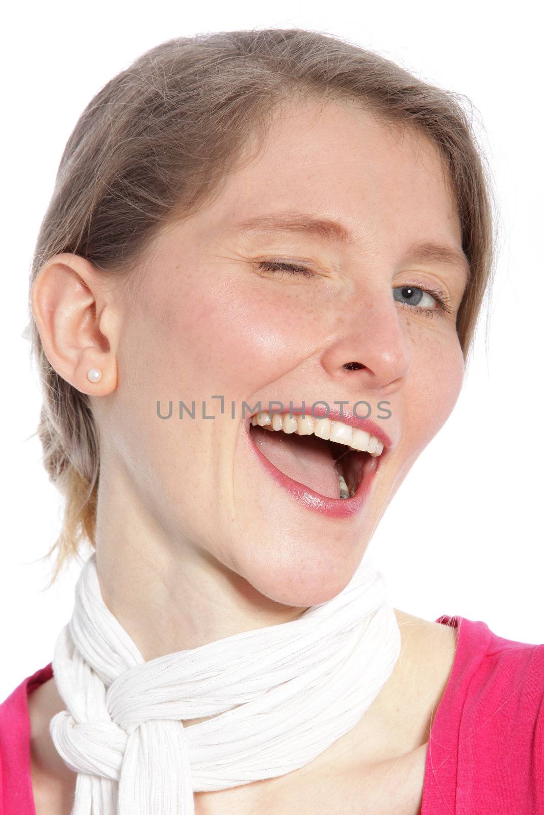 Happy mid age woman blinking an eye against the white background