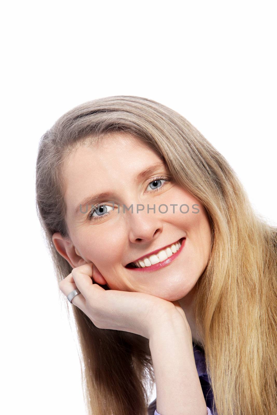 Close up shot of blonde woman with a toothy smile