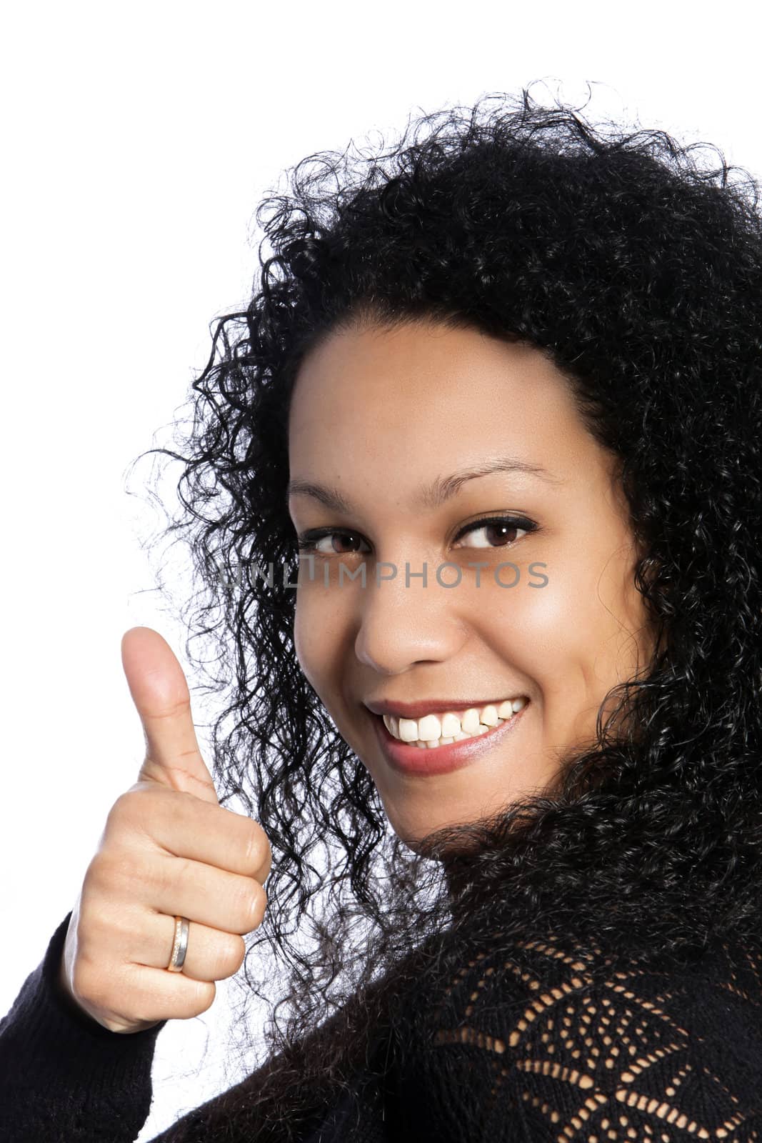 Smiling African woman with thumbs up in a close up shot