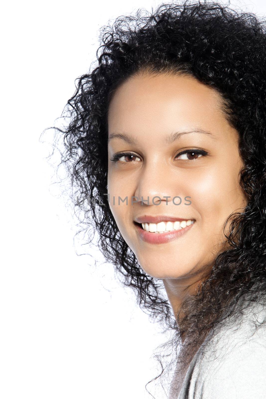 Happy young beautiful woman with long black curly hair