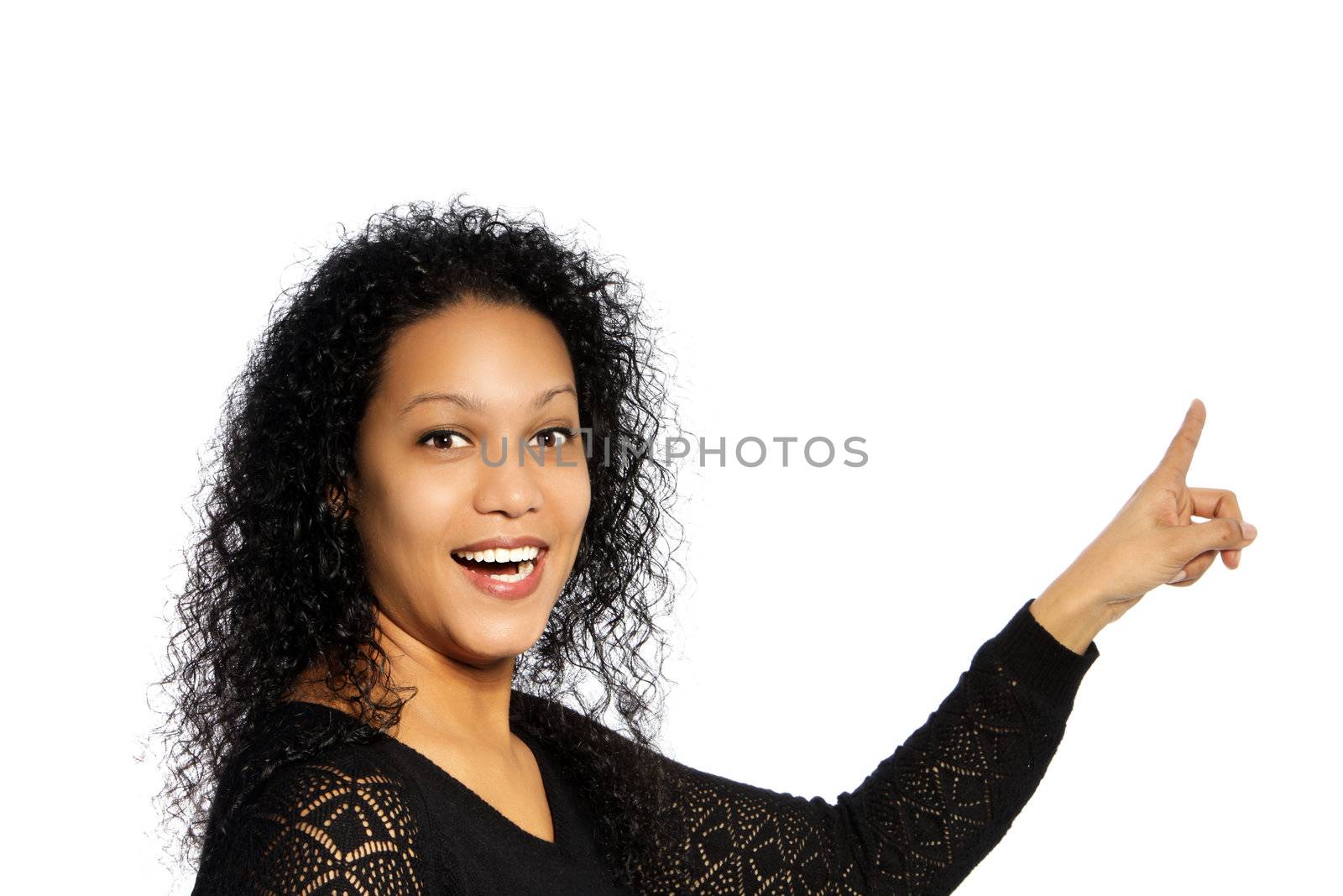 Surprised African American woman in pointing up gesture