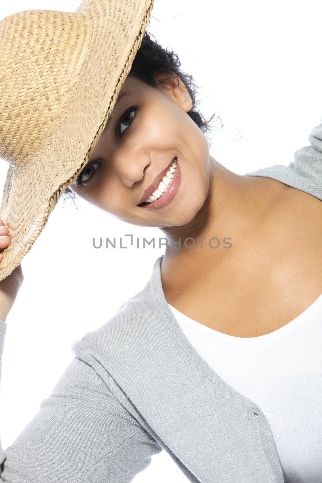 Pretty young woman wearing a hat over the white background