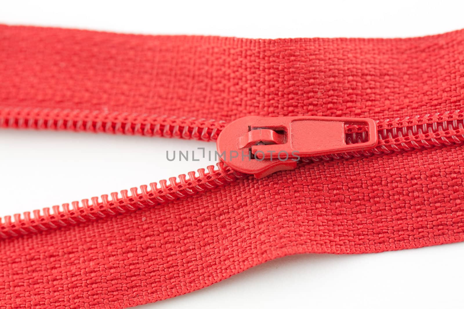 Open red zipper on a white background