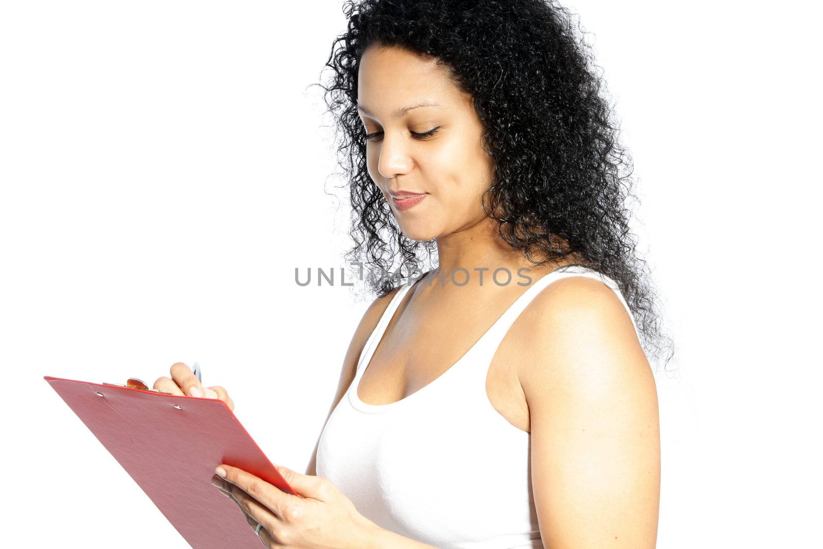 Pretty woman writing on a red folder isolated on white