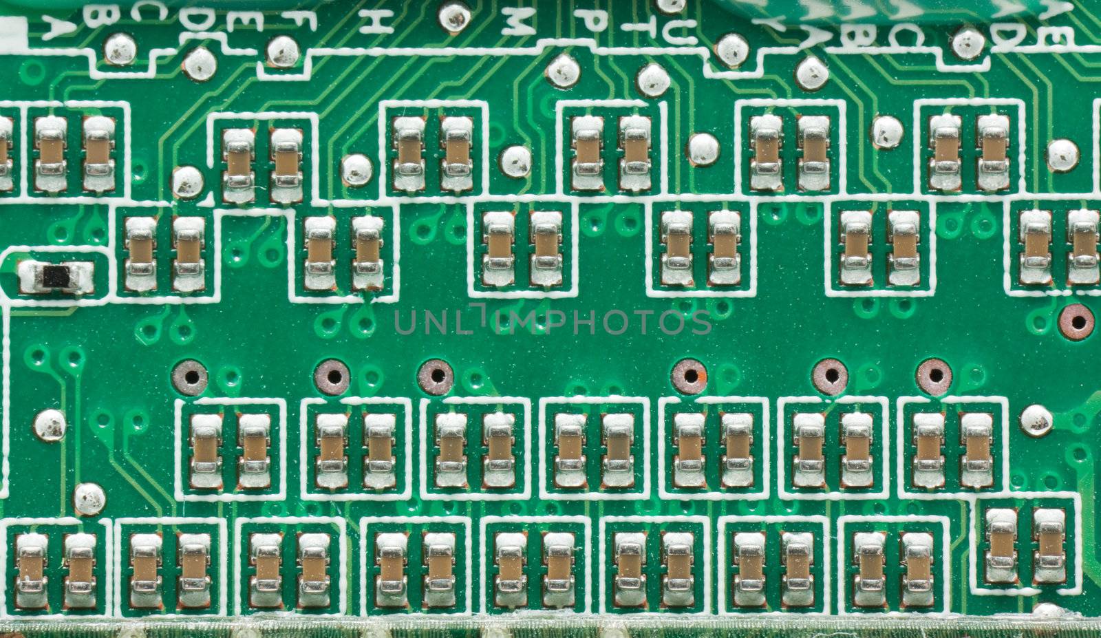 Green circuit board with components