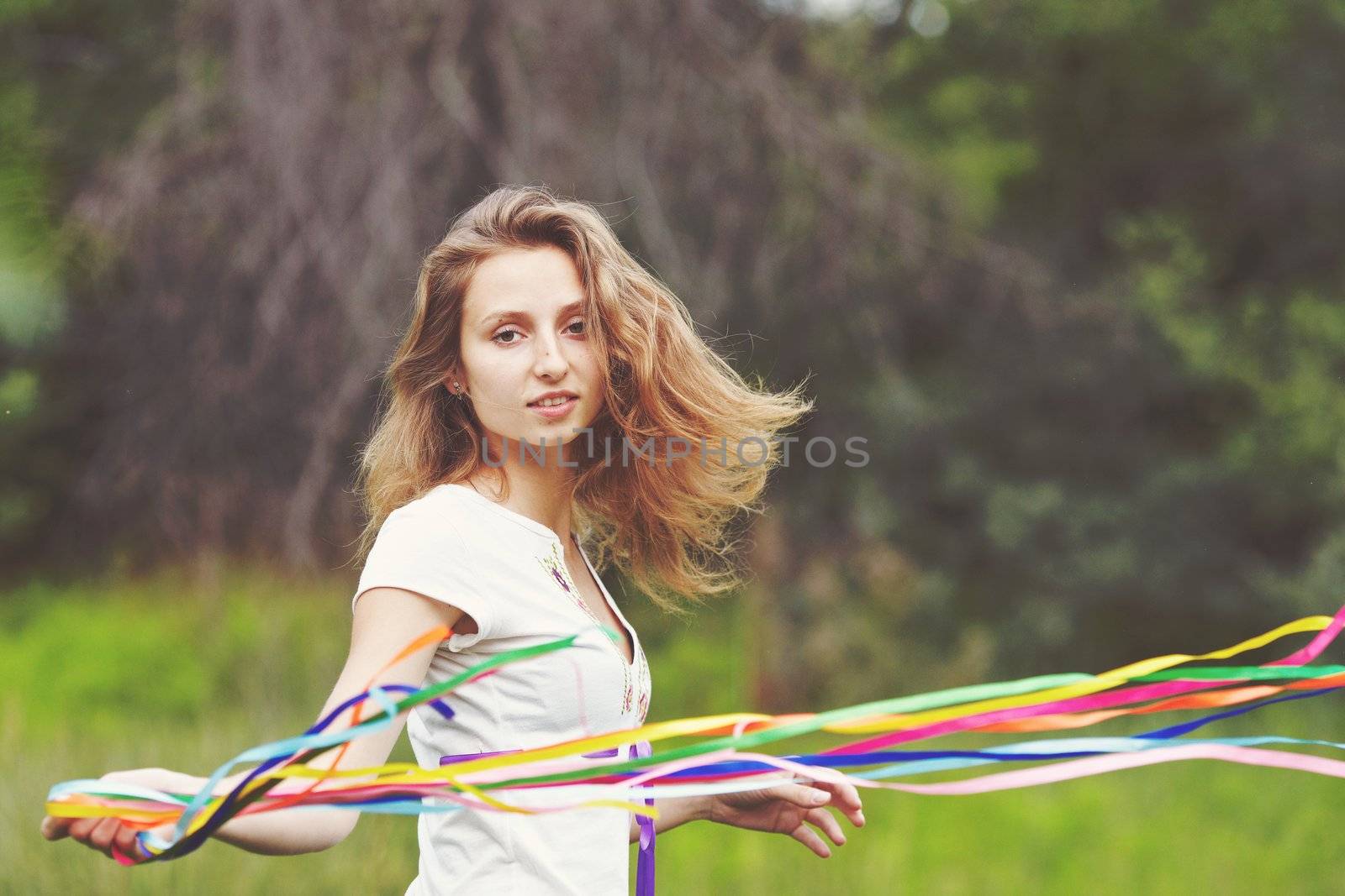 Beautiful girl with ribbons. Early morning photo